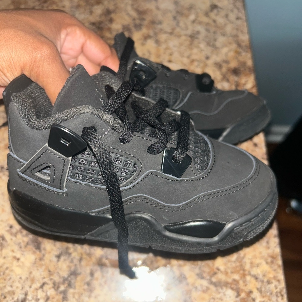 Black Cat Jordan 4’s